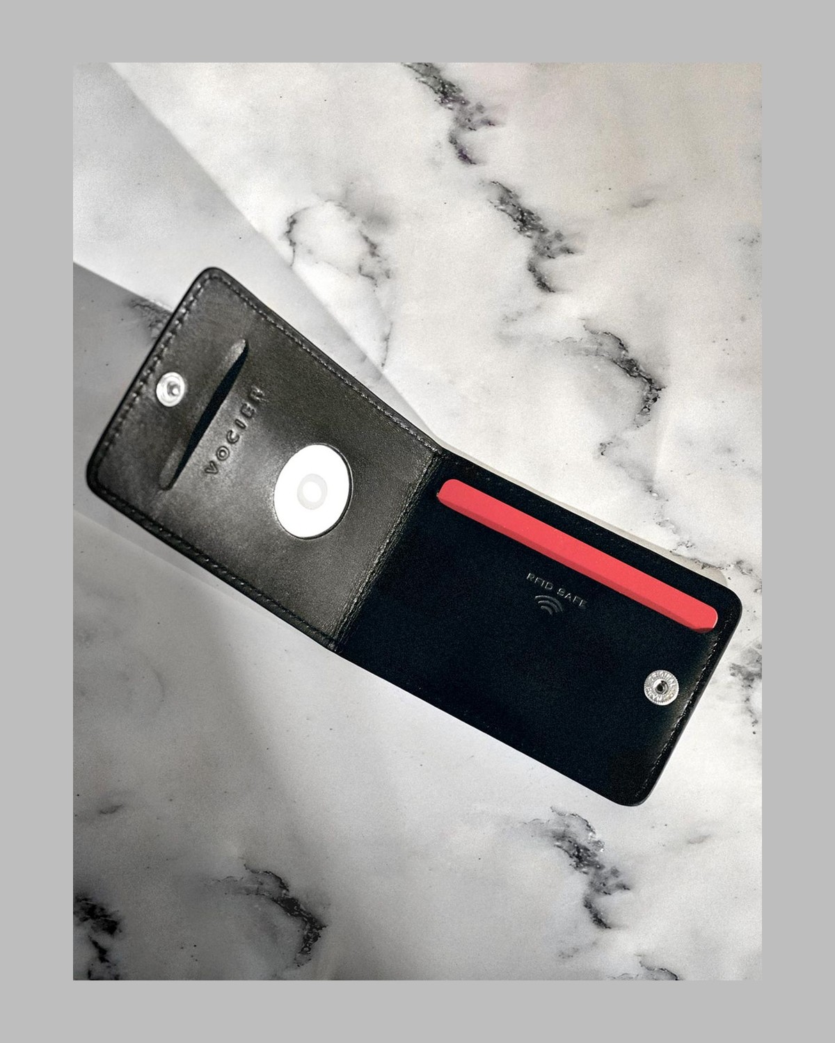 VOCIER leather card holder with an Apple AirTag seated in its circular pocket